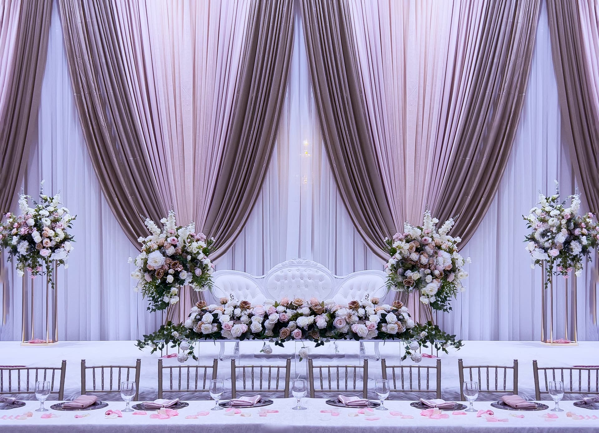 Mauve-draped wedding reception head table