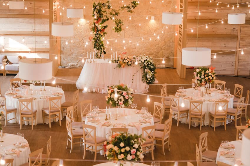 Elegantly appointed wedding reception with soft drapery and candlelight